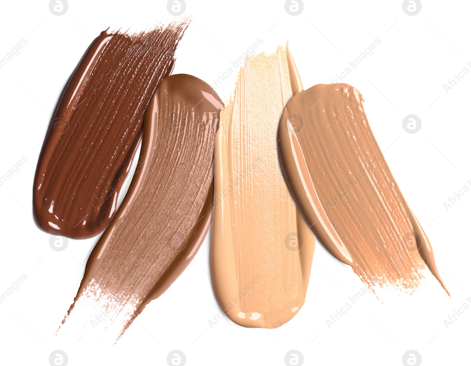 Image of Foundation of various shades for different skin tones isolated on white, top view. Set of samples