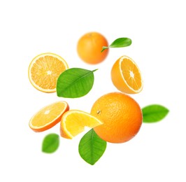 Image of Cut and whole oranges with green leaves flying on white background