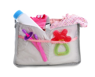 Maternity bag with baby accessories on white background