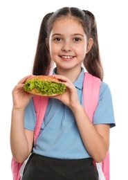Photo of Happy girl with burger on white background. Healthy food for school lunch