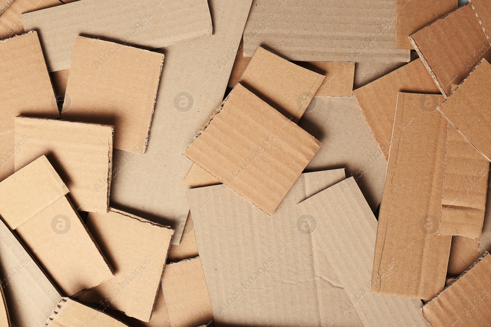 Photo of Pieces of brown cardboard as background, top view. Recyclable material