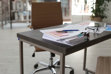 Stack of documents on table in office