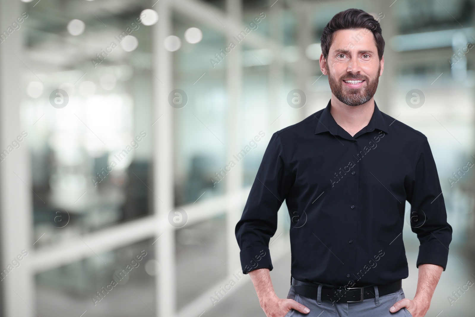 Image of Portrait of handsome confident man in office, space for text