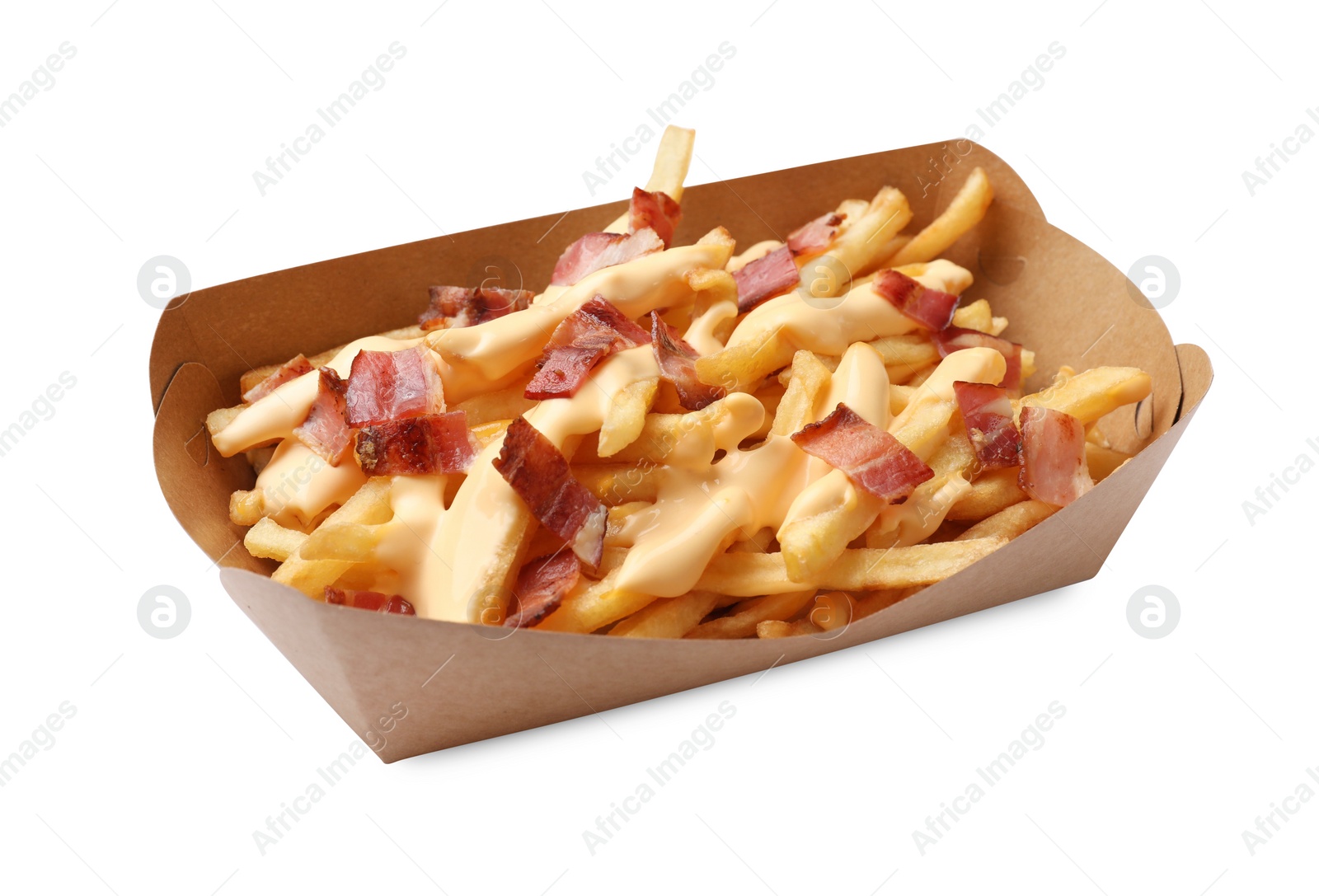 Photo of Tasty potato fries, cheese sauce and bacon in paper container isolated on white