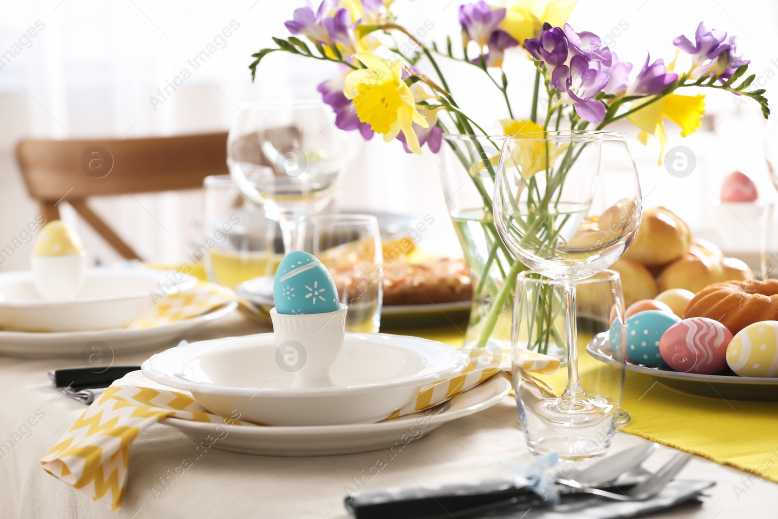 Photo of Festive Easter table setting with traditional meal at home