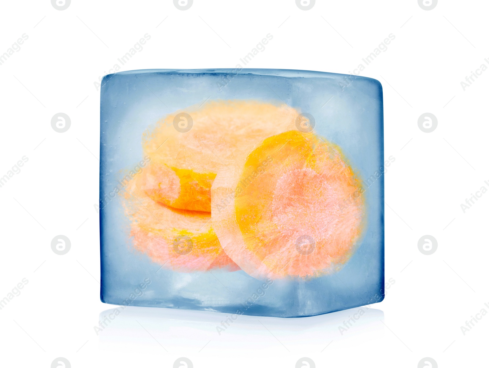 Image of Frozen food. Raw carrot in ice cube isolated on white