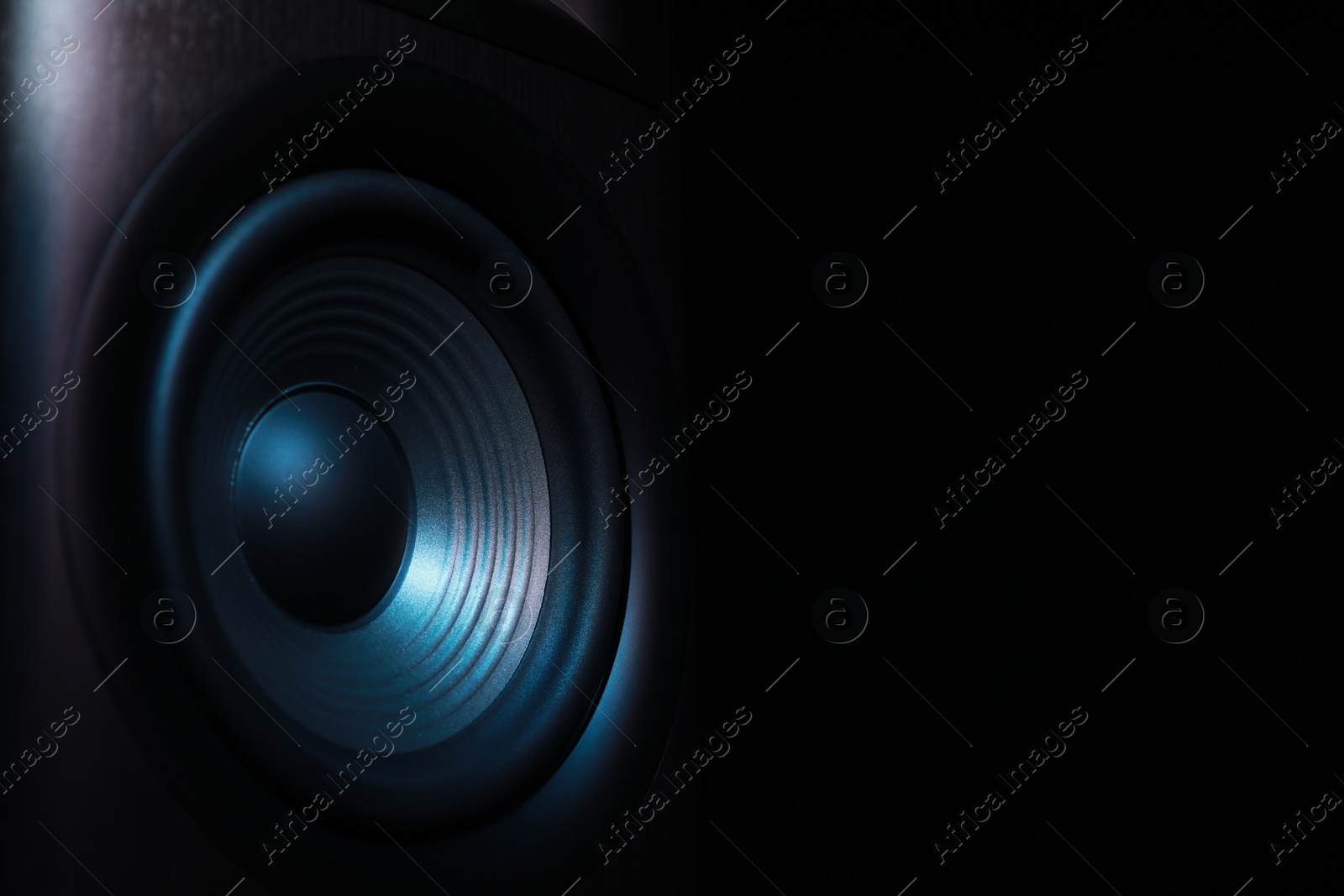 Photo of One sound speaker on black background, closeup. Space for text