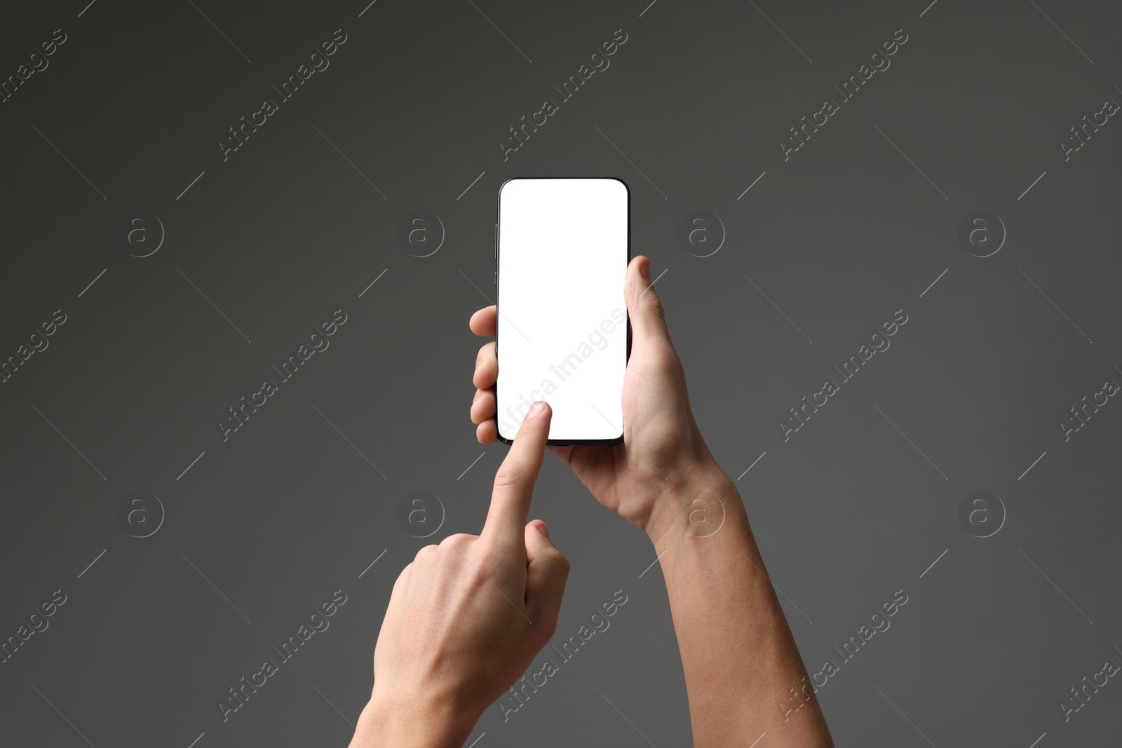 Photo of Man using smartphone with blank screen on grey background, closeup. Mockup for design