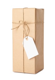 Gift box wrapped in kraft paper with bow and tag isolated on white