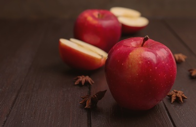 Photo of Fresh yummy apple on wooden table
