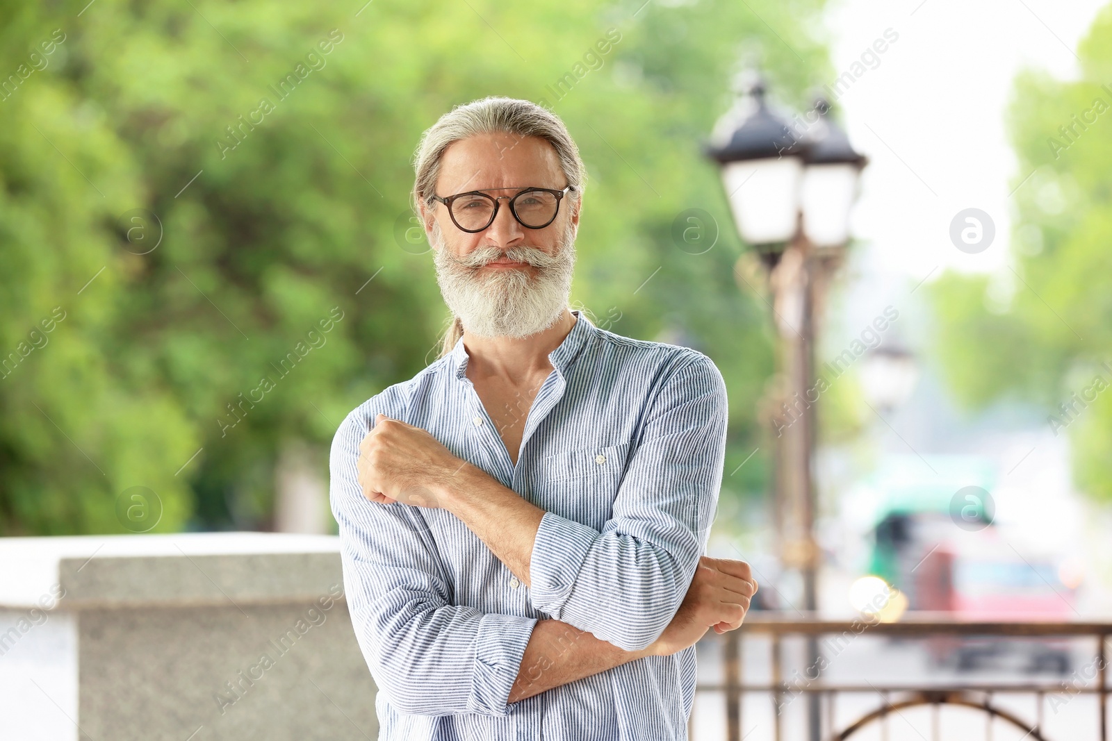 Photo of Portrait of handsome bearded mature man, outdoors