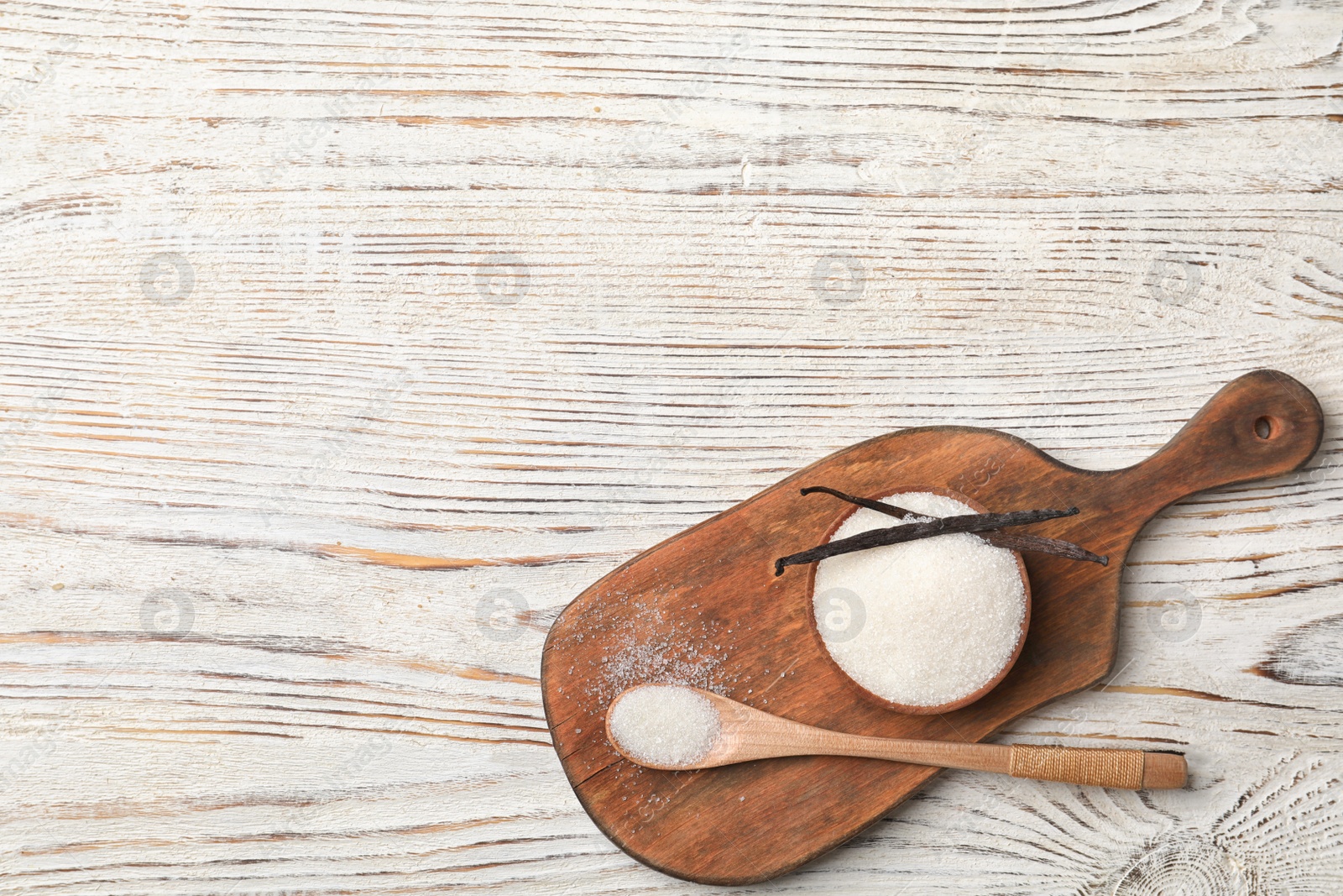 Photo of Flat lay composition with vanilla sugar on wooden background