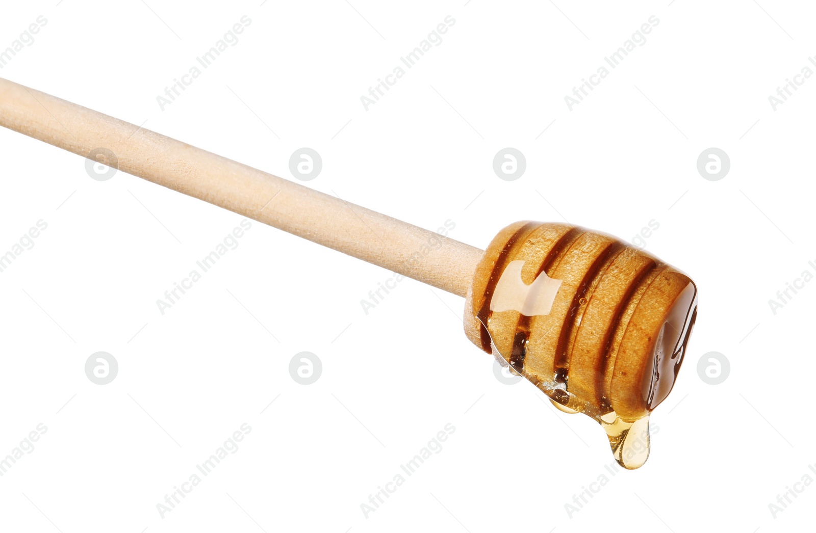 Photo of Natural honey dripping from dipper on white background