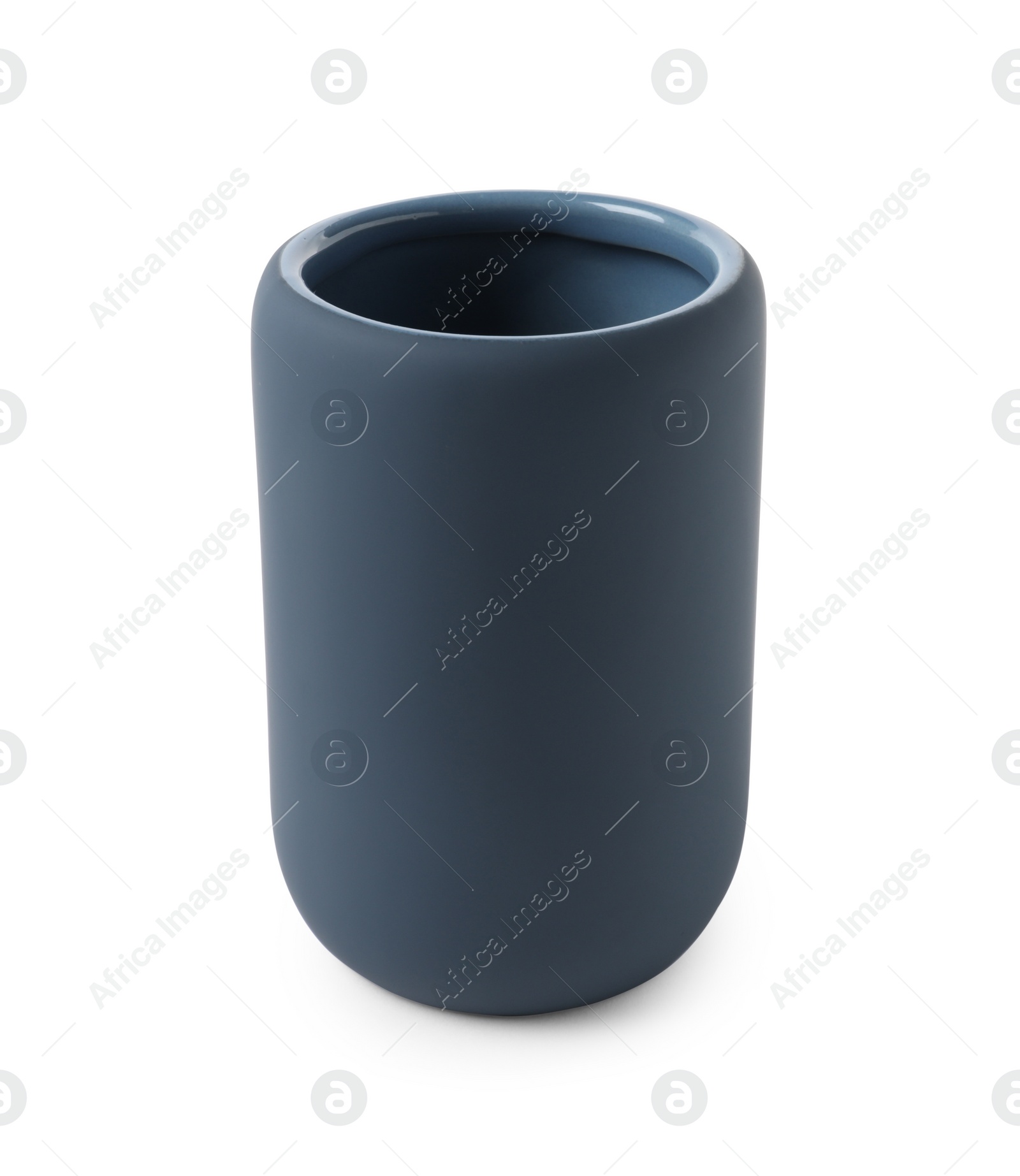 Photo of Bath accessory. Dark blue ceramic toothbrush holder isolated on white