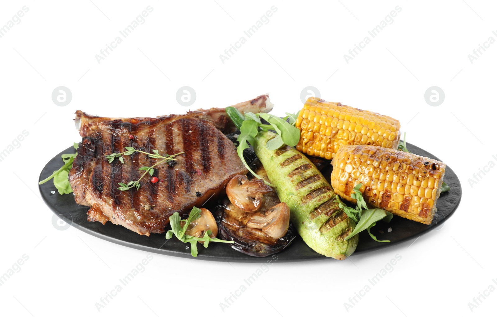 Photo of Delicious beef steak served with vegetables isolated on white