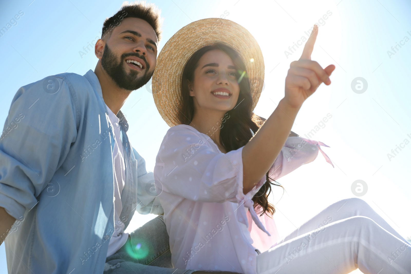 Photo of Happy young couple outdoors on sunny day. Honeymoon trip