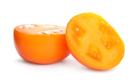 Photo of Pieces of fresh ripe yellow tomato on white background