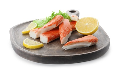 Photo of Serving plate with pieces of crab sticks on white background, closeup