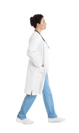 Full length portrait of female doctor isolated on white. Medical staff