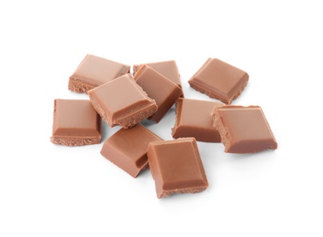 Photo of Delicious milk chocolate pieces on white background