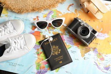 Photo of Tourist items on world map, above view. Travel agency