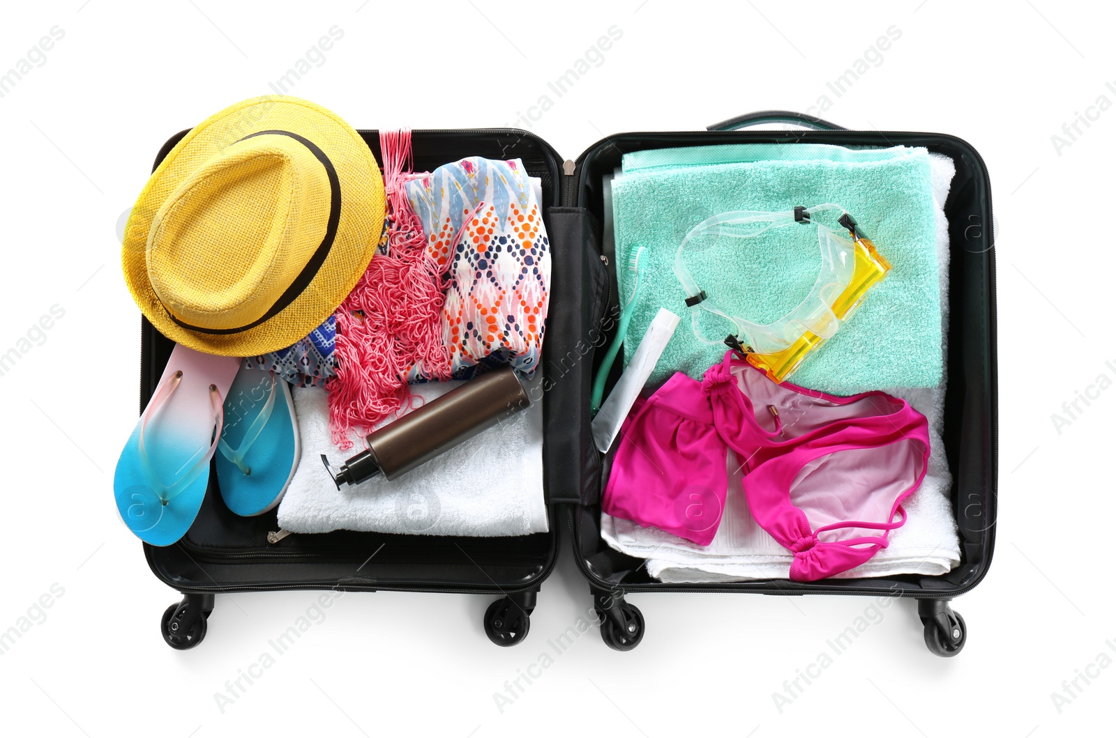 Photo of Packed suitcase with summer clothes and accessories on white background, top view