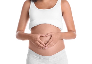 Pregnant woman posing on white background, closeup