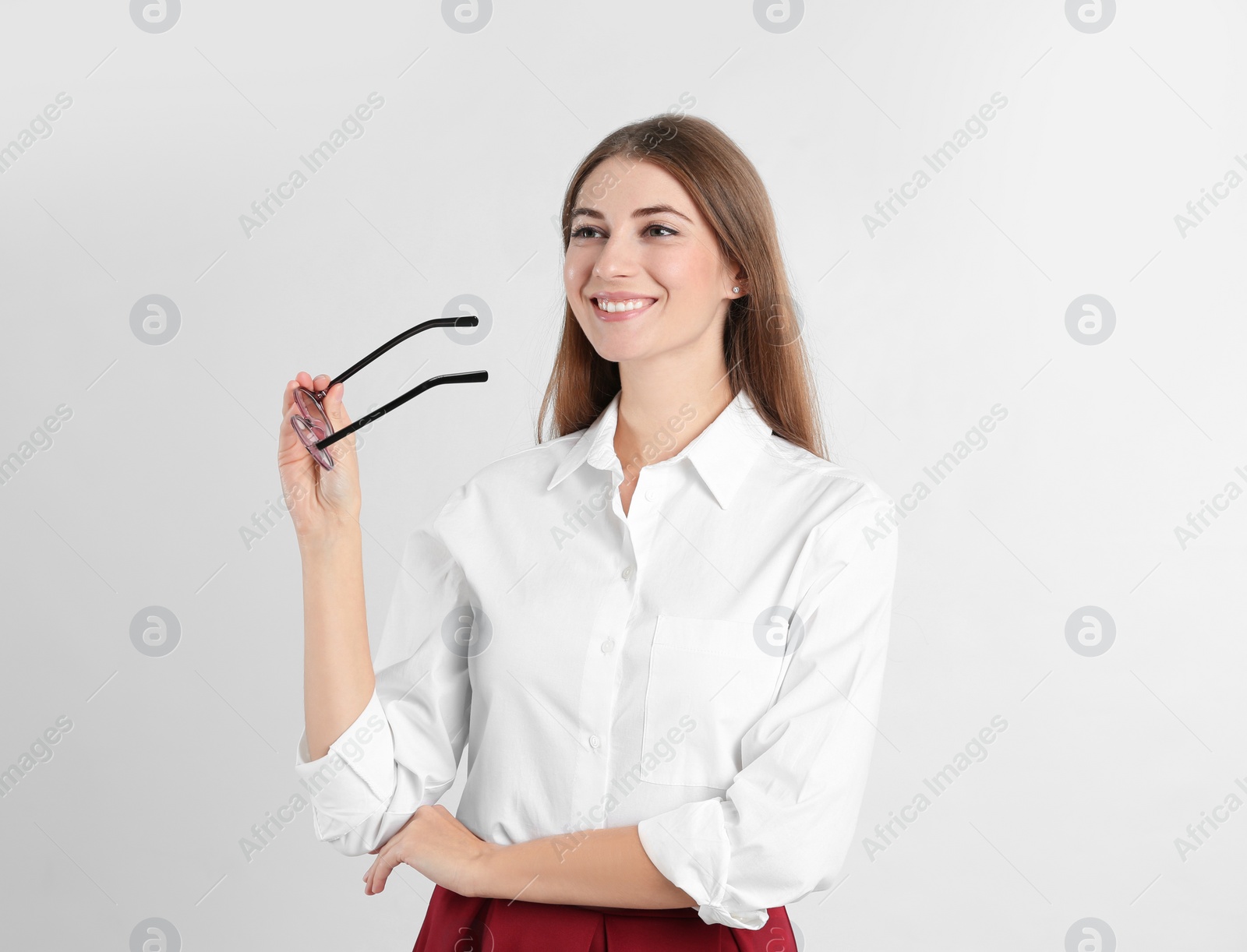 Photo of Portrait of beautiful young businesswoman on white background