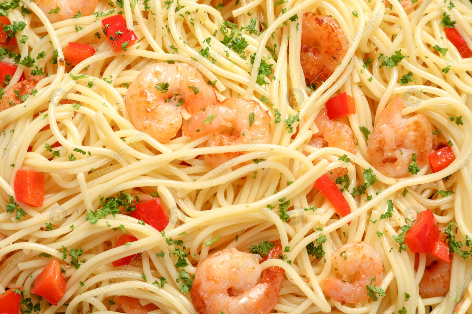 Photo of Delicious spaghetti with shrimps, closeup