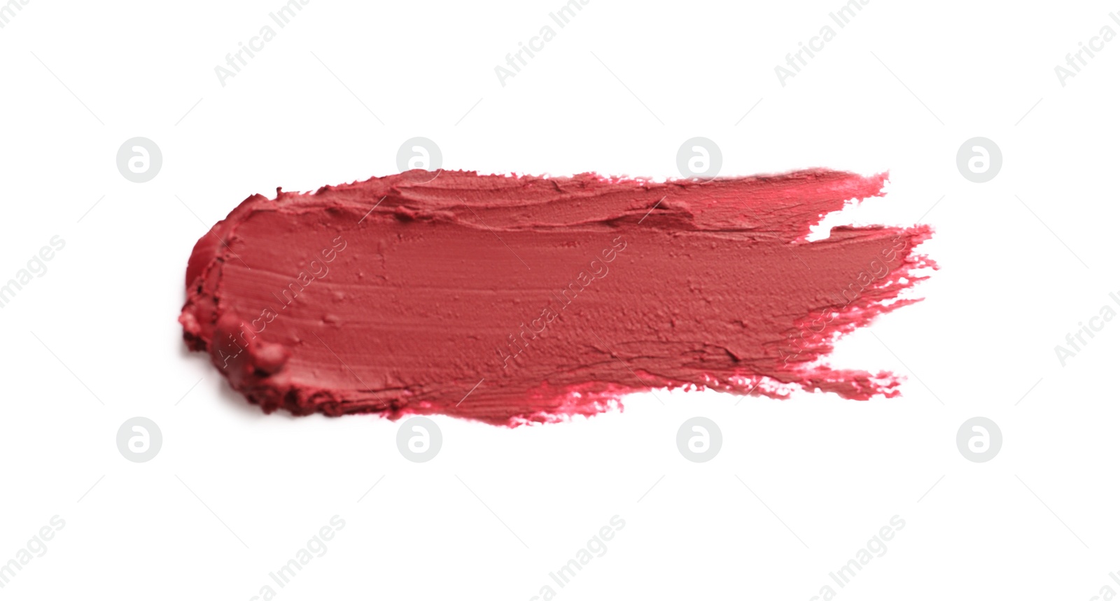 Photo of Smear of bright lipstick on white background, top view