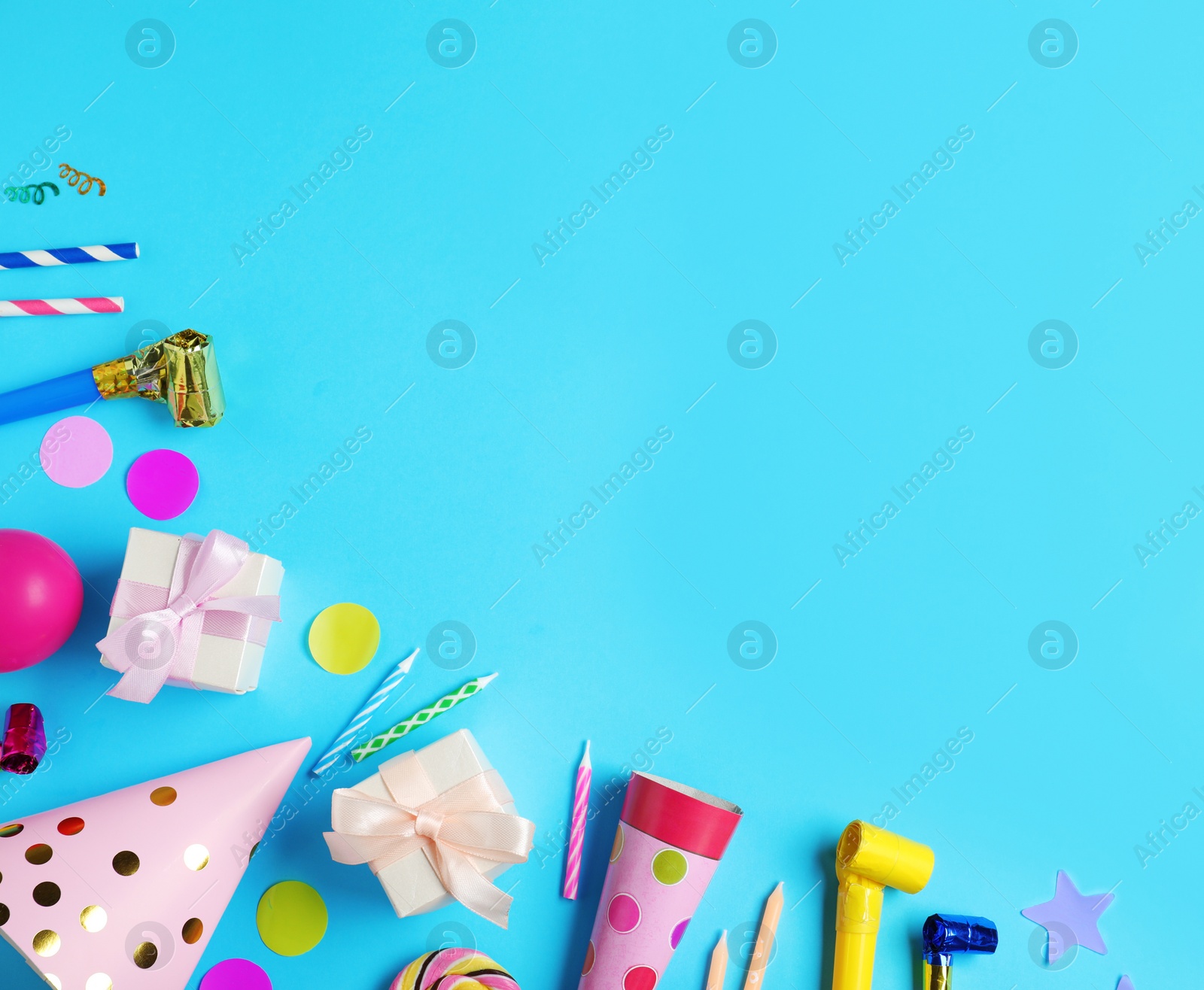 Photo of Flat lay composition with different birthday party items on light blue background, space for text