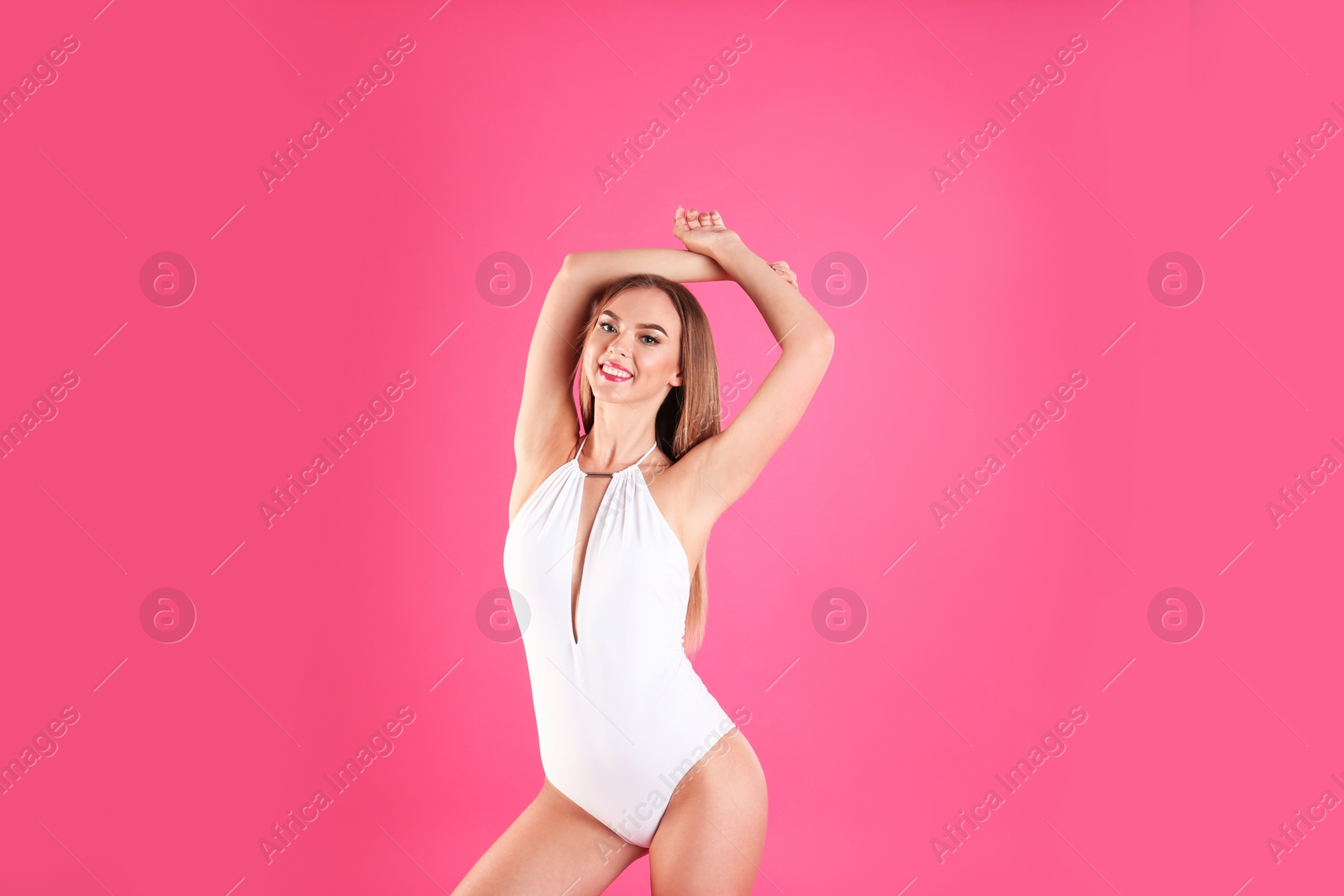 Photo of Pretty sexy woman with beautiful slim body in stylish bikini on color background