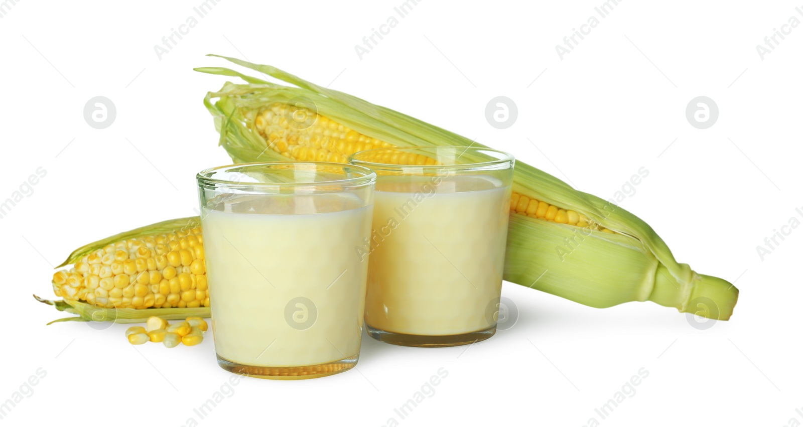 Photo of Tasty fresh corn milk in glasses and cobs on white background