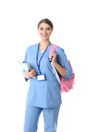 Young medical student with notebooks and backpack on white background