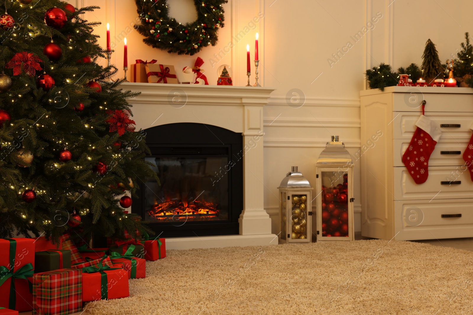 Photo of Cozy living room with Christmas tree near fireplace. Interior design