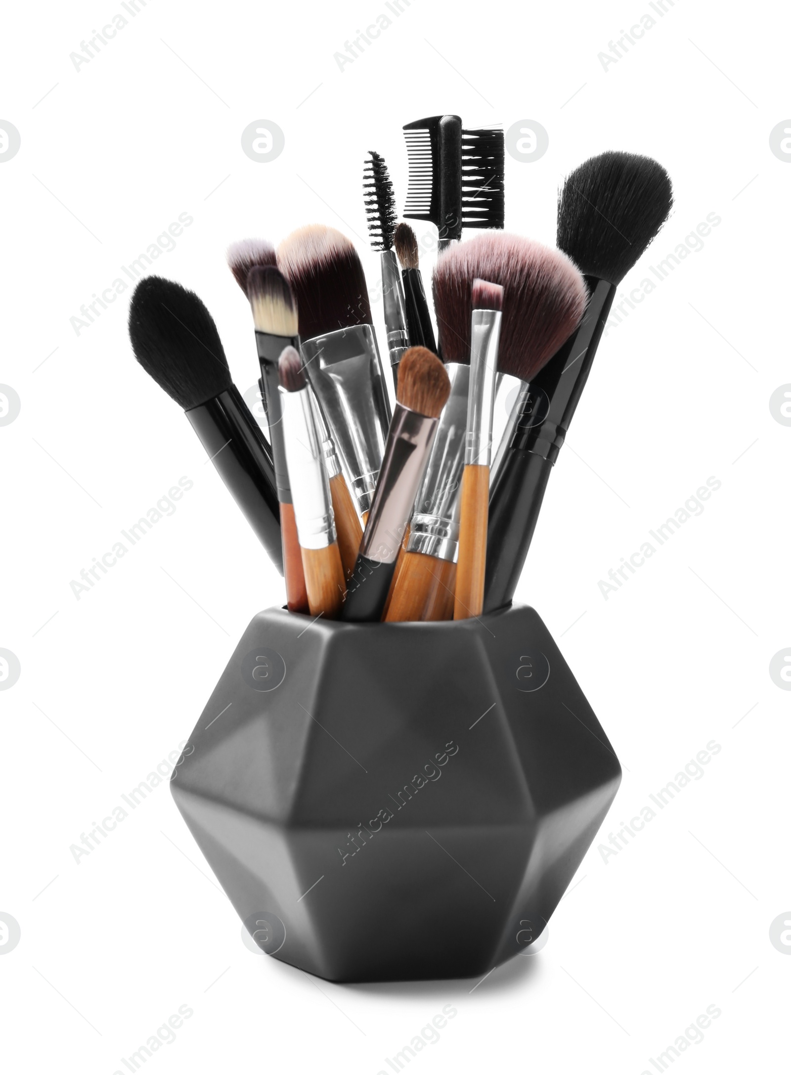 Photo of Holder with makeup brushes of professional artist on white background