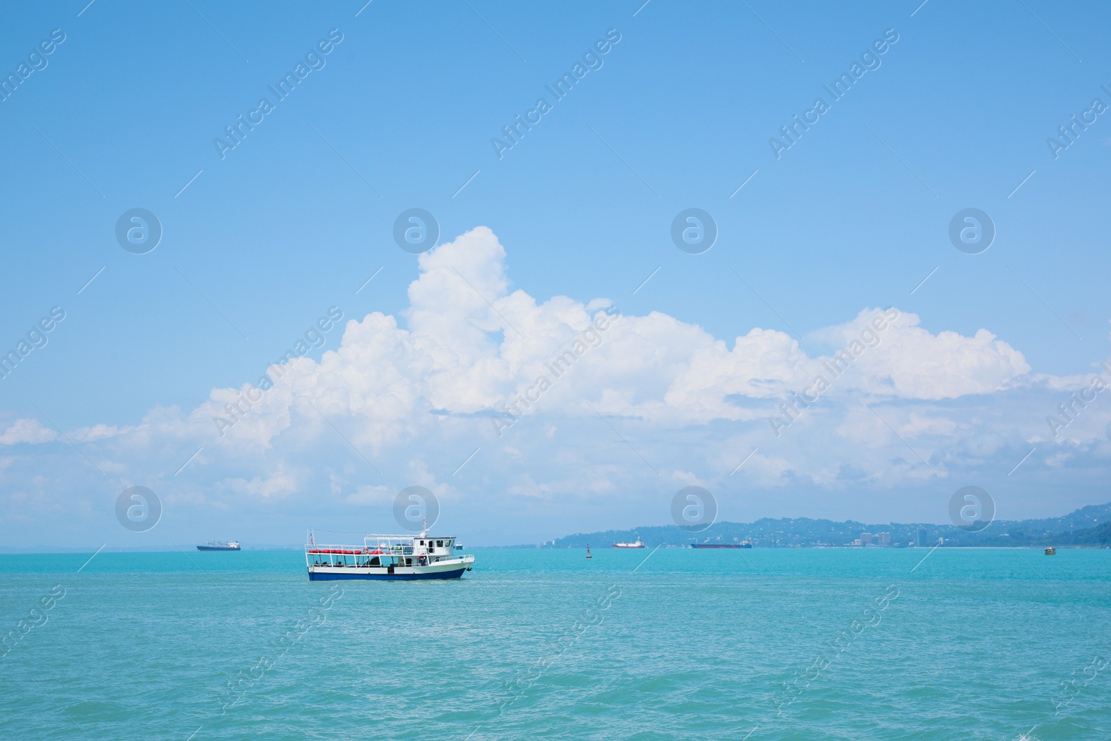 Photo of Beautiful tranquil sea with boats on sunny summer day