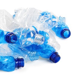 Photo of Crumpled disposable plastic bottles on white background, space for text