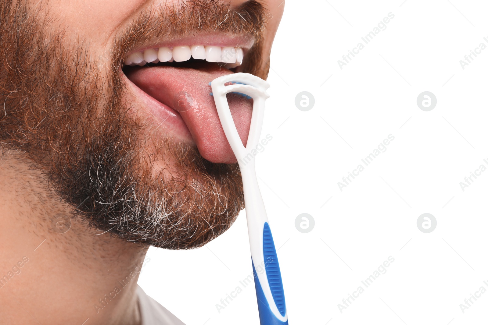 Photo of Man brushing his tongue with cleaner on white background, closeup