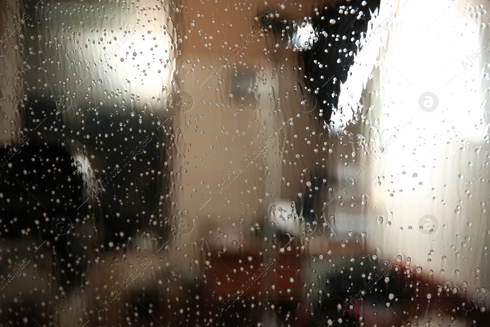 Photo of Car window covered with tinting foil and foam, closeup