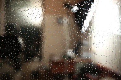 Car window covered with tinting foil and foam, closeup