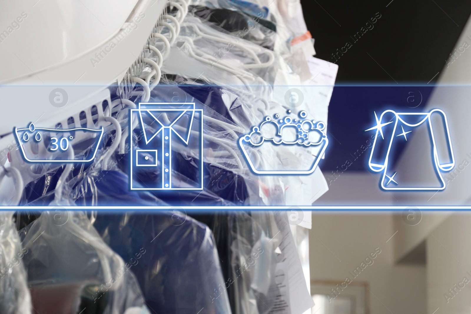 Image of Different icons and hangers with clothes on garment conveyor at dry-cleaner's