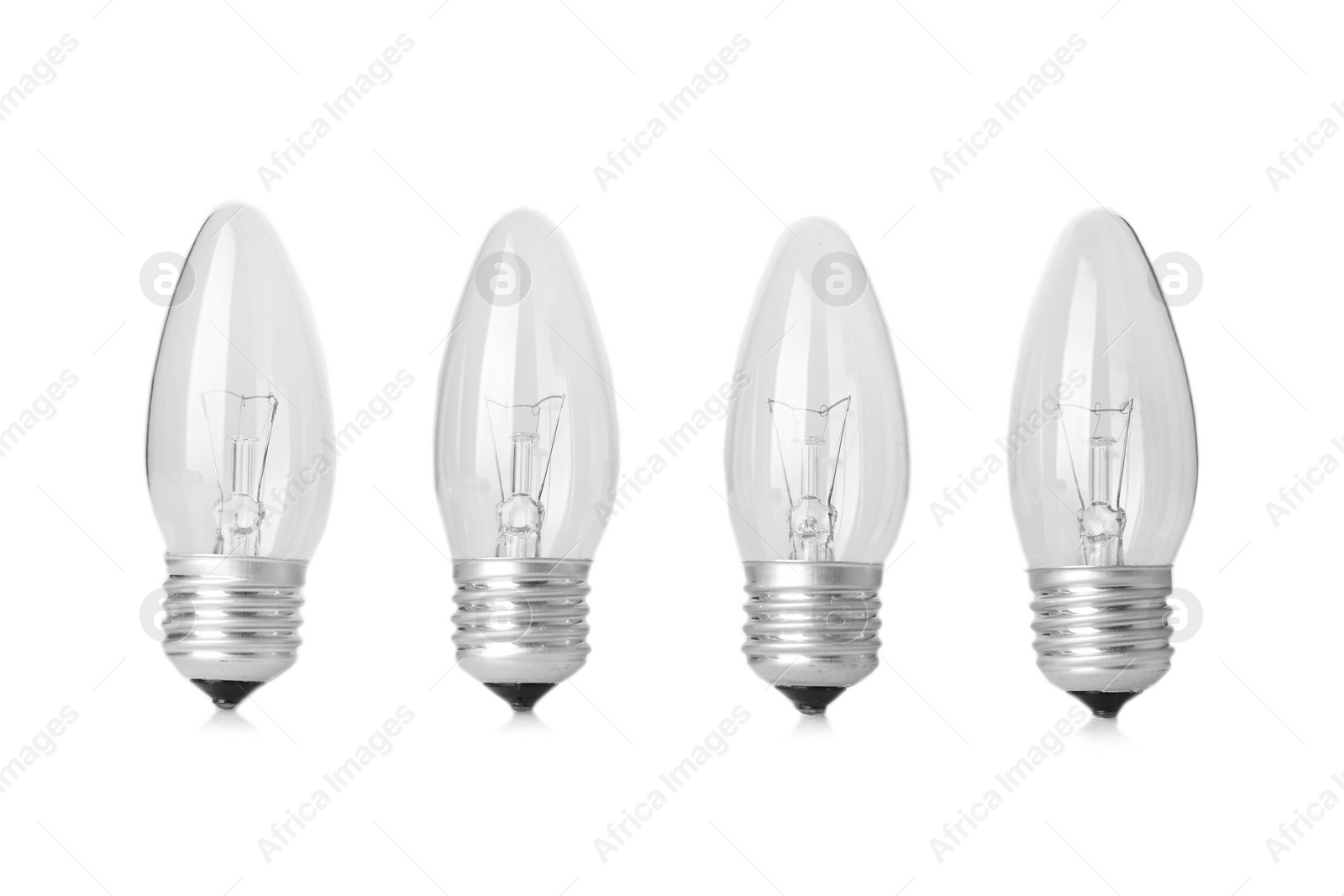 Photo of New incandescent lamp bulbs on white background