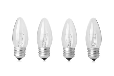 Photo of New incandescent lamp bulbs on white background