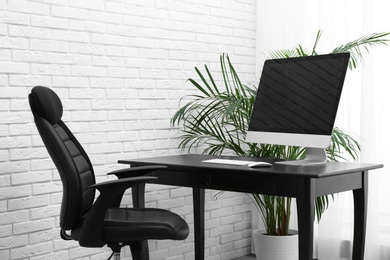 Stylish workplace interior with modern office chair