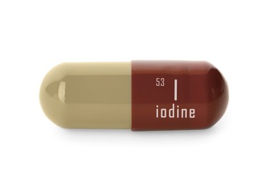 Image of Iodine capsule on white background. Mineral element