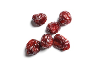 Photo of Cranberries on white background, top view. Dried fruit as healthy snack