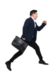Businessman in suit with briefcase running on white background