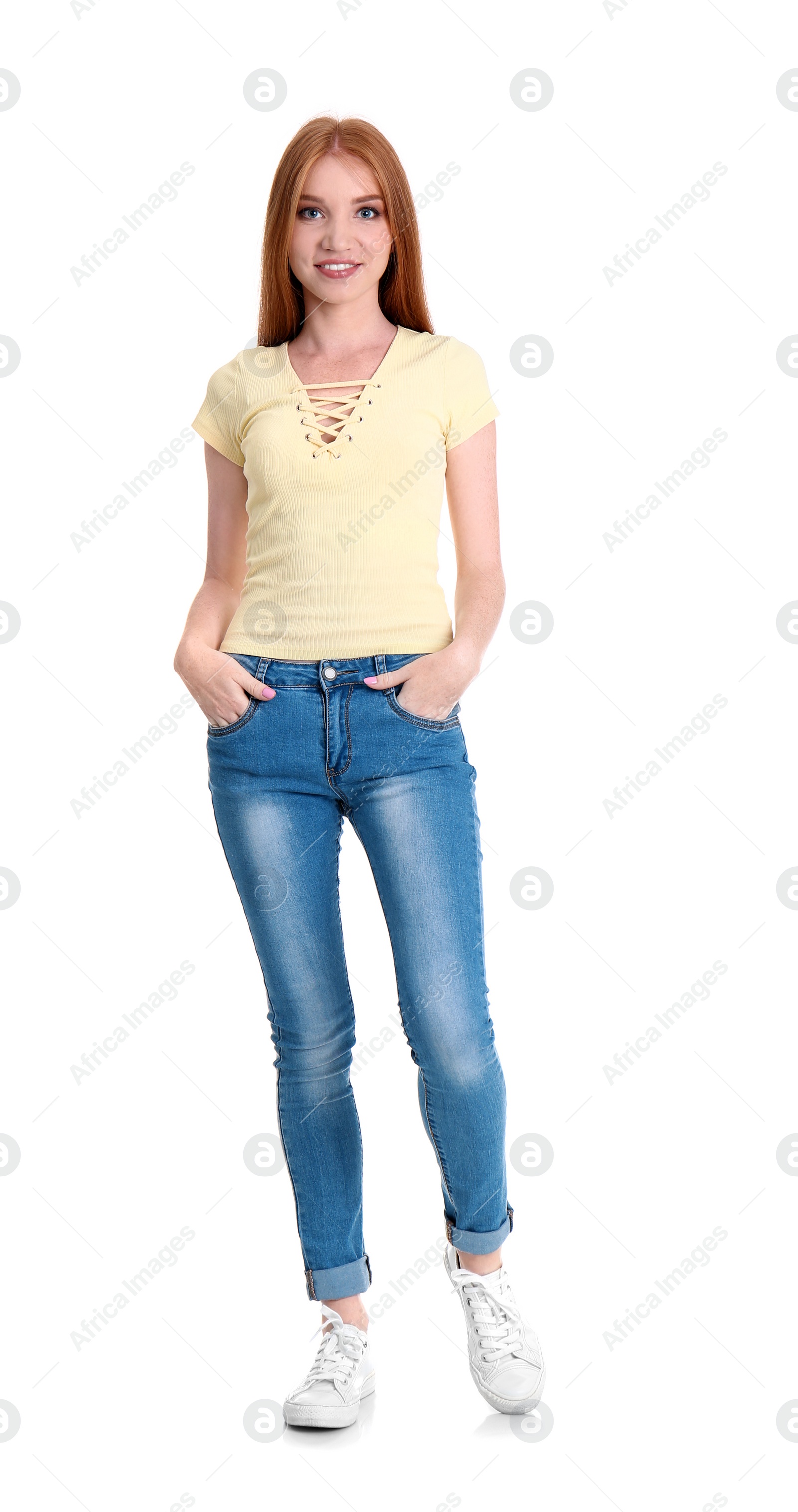 Photo of Young woman in stylish jeans on white background