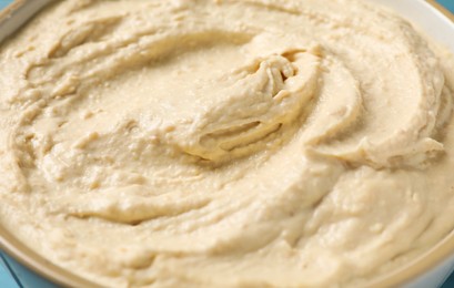 Tasty hummus in bowl, closeup. Delicious appetizer